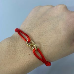 14kt gold red rope bracelet!!! The center is made of 14kt gold!! Adjustable too